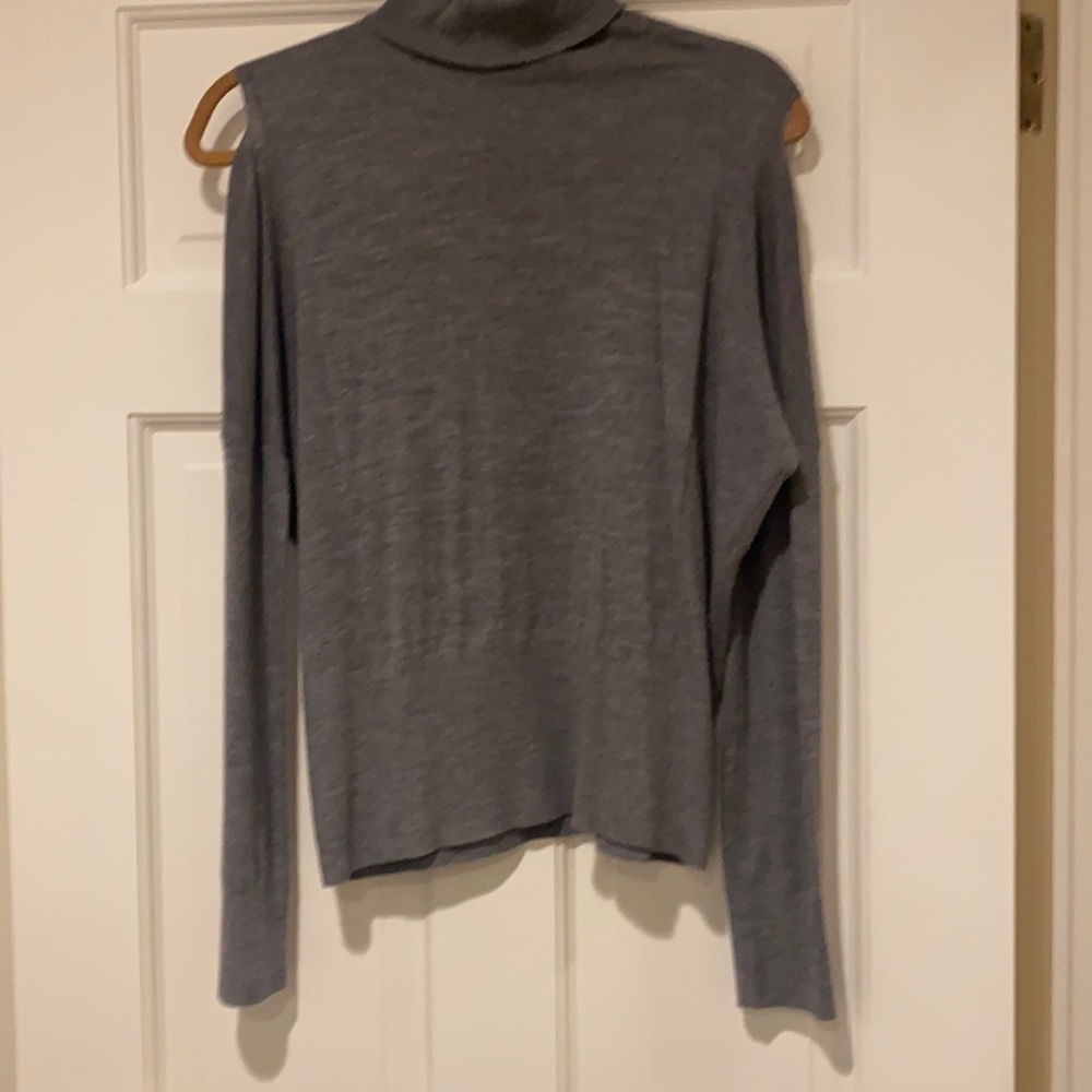Woman’s Bare Shoulder Sweater